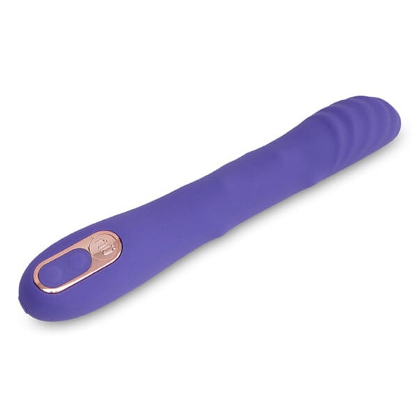 Purple silicone sex toy with button.