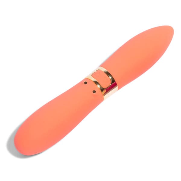 Coral pink sex toy with gold accents.