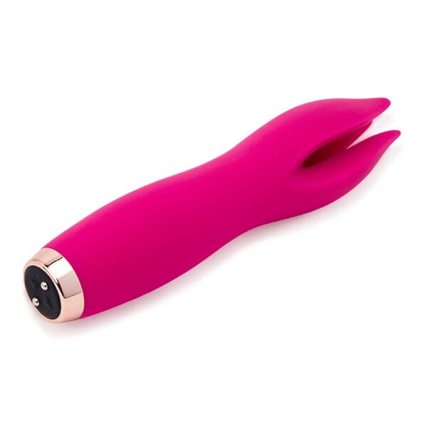 Pink silicone toy with gold accents.