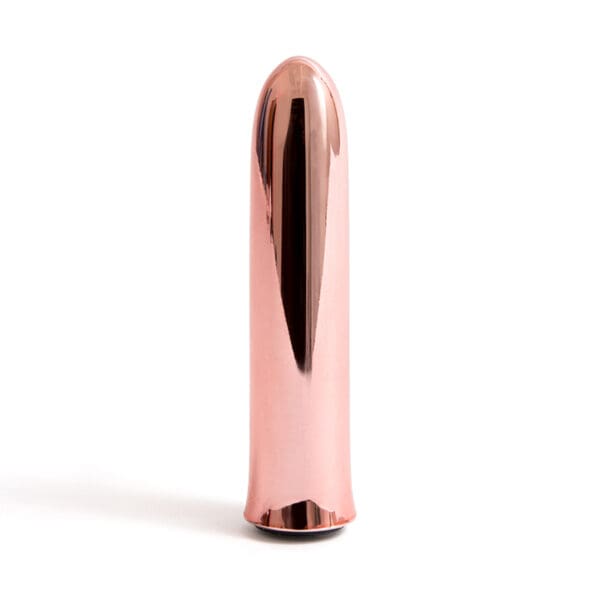 Rose gold metallic cylindrical object.