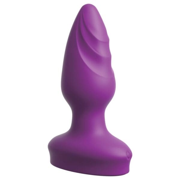 A purple butt plug is sitting on top of the floor.