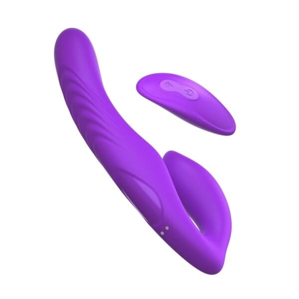 A purple sex toy is laying on top of the floor.
