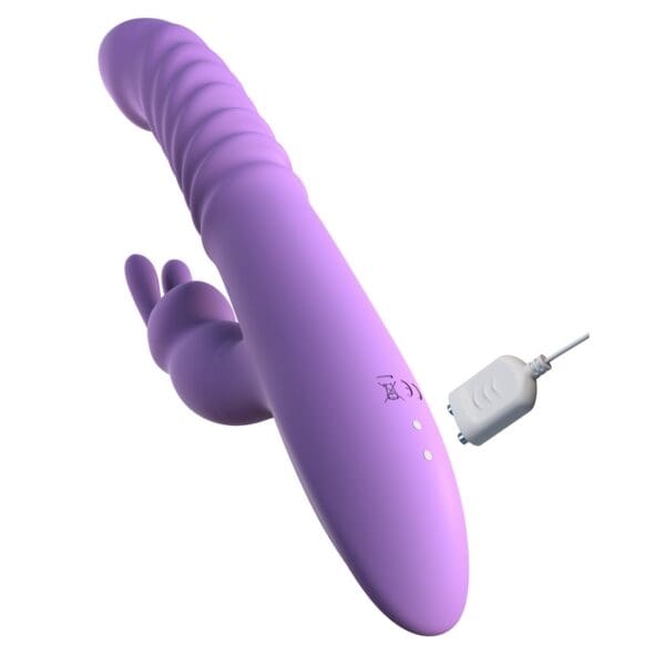 A purple vibrator is next to the plug.