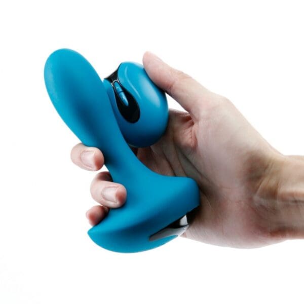 A person holding a blue controller in their hand.