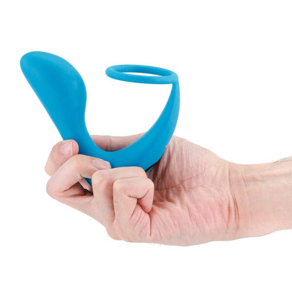 A person holding a blue toy in their hand.