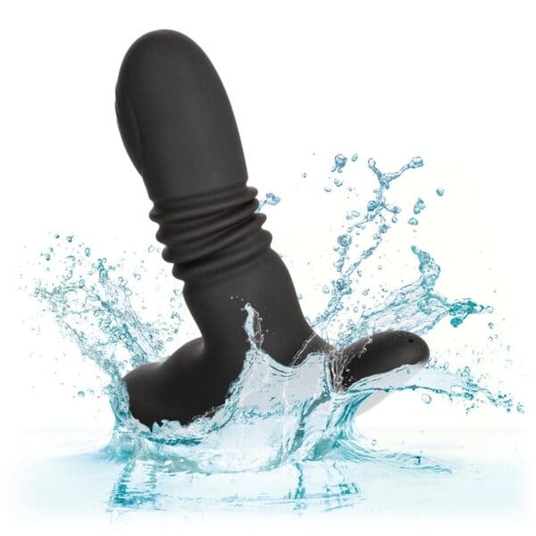 A black dildo in the water with some socks on