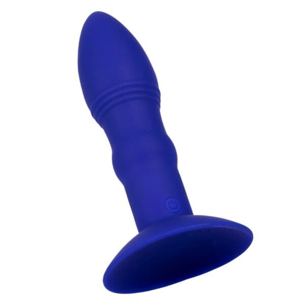 A blue dildo is sitting on top of the floor.