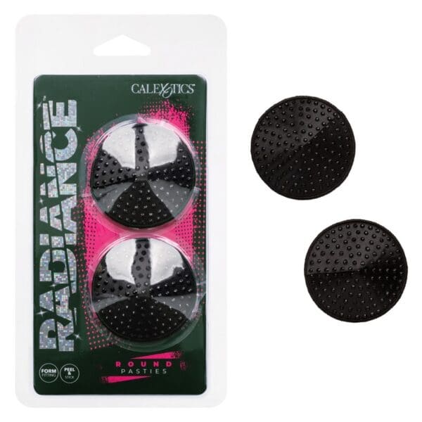 A pair of black and white buttons in packaging.