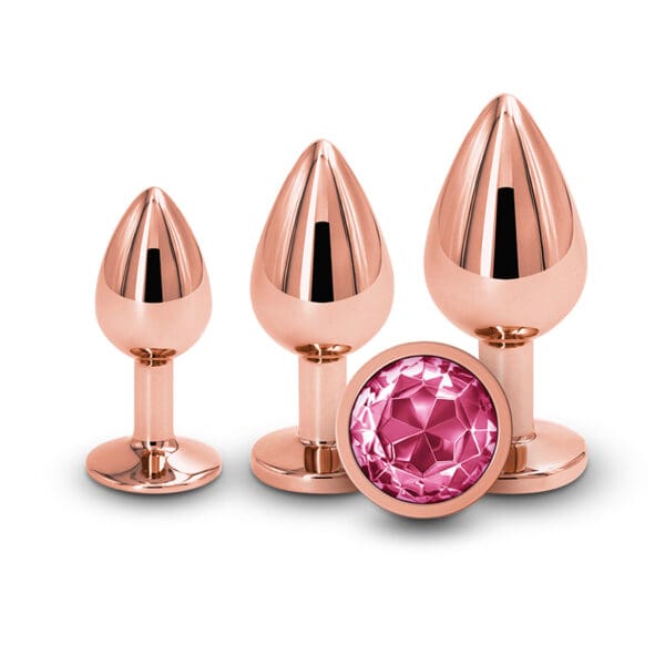 Rose gold anal plugs with pink jewel.